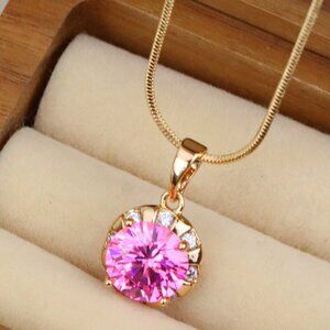 "Round Pink Pendant with Gold Finish and Crystal Accents, XPPT1650